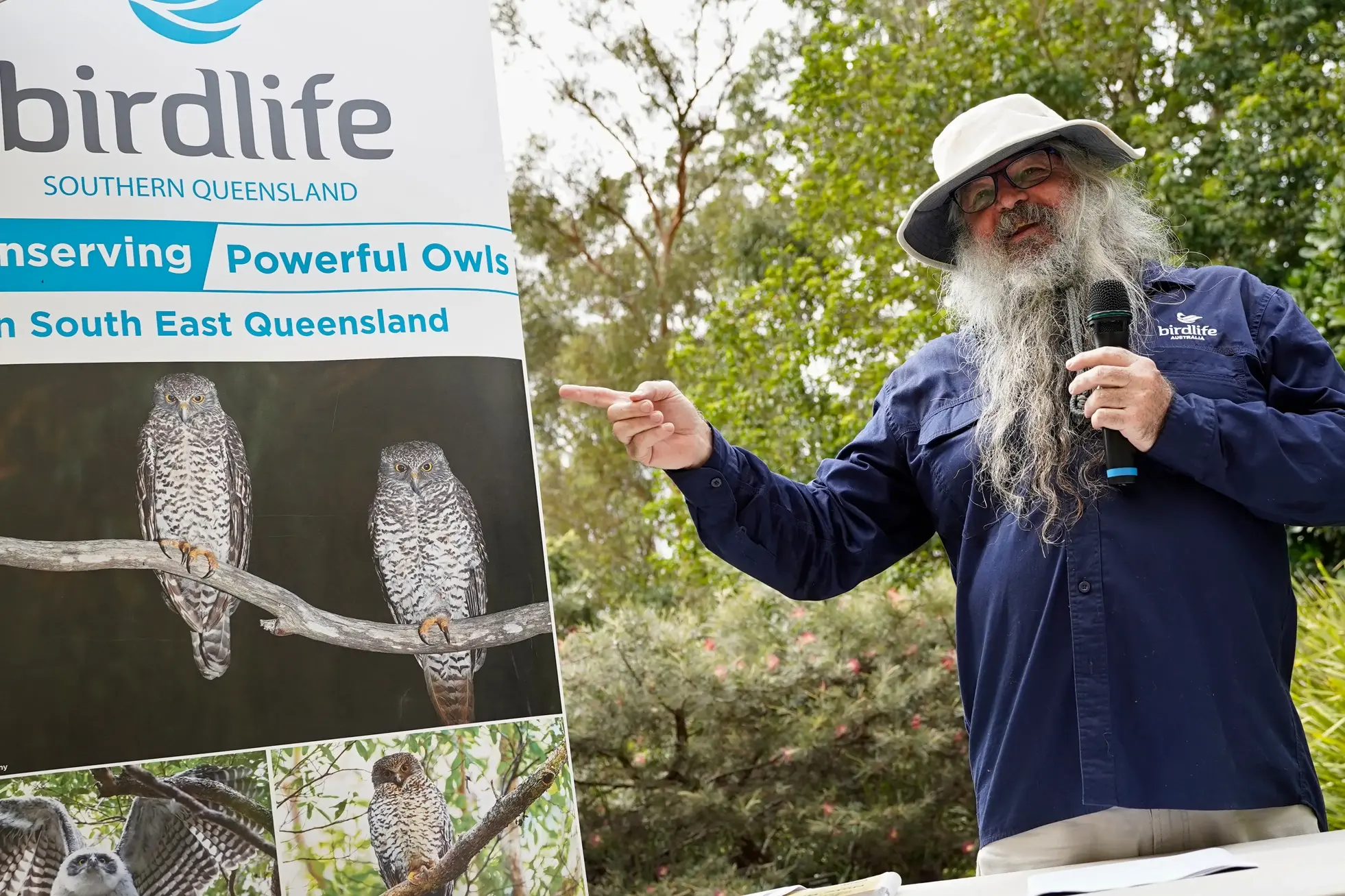Andrew Dinwoodie presenting a talk about Powerful Owls outside